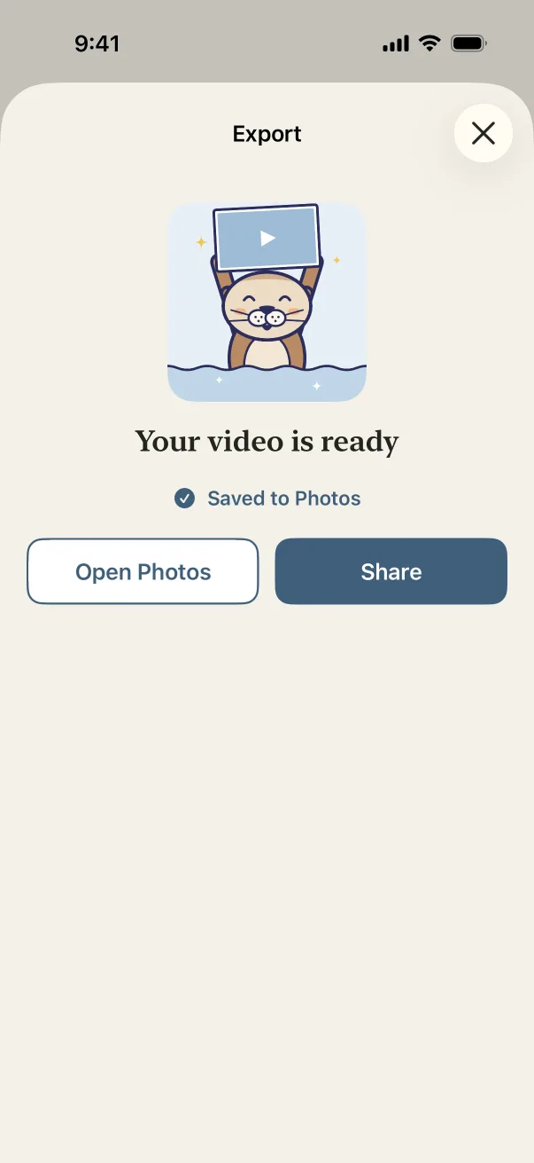 Your video is ready: Otis holds up a video, and it says Saved to Photos